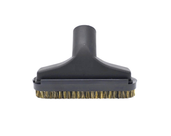 Upholstery tool features a directional slide brush which assures a consistent fit and detaches for aggressive clea